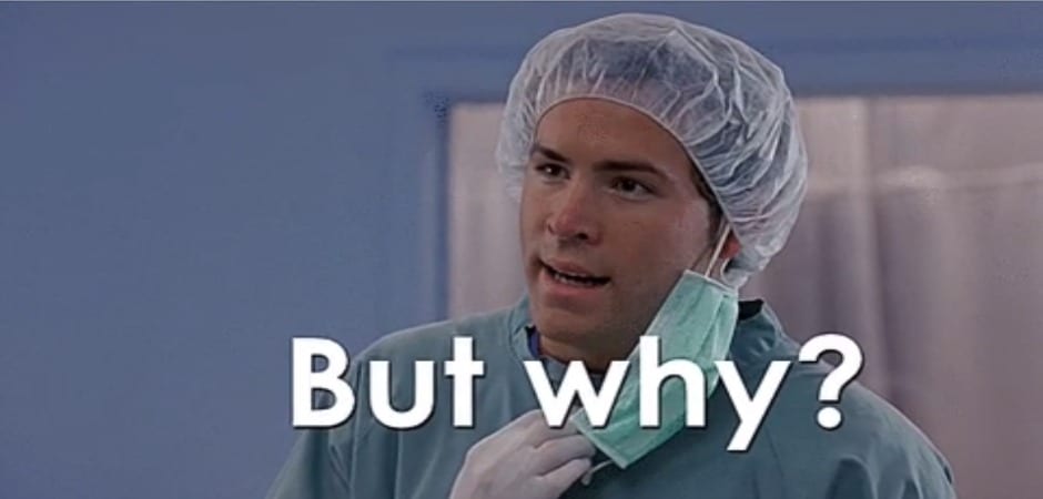 A nurse in scrubs taking off his mask and showing a confused face while asking "... But why?".